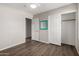Bedroom features wood-look floors and sliding closet doors at 4942 W Novak Way, Laveen, AZ 85339