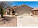Charming single-story home featuring a two-car garage and covered front porch at 4942 W Novak Way, Laveen, AZ 85339
