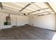 An empty garage features an electric door opener and water heater at 4942 W Novak Way, Laveen, AZ 85339
