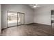 Spacious living area with a sliding glass door and modern flooring at 4942 W Novak Way, Laveen, AZ 85339