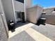 Private backyard area, complete with patio, grill and air conditioning unit at 500 N Roosevelt Ave # 53, Chandler, AZ 85226