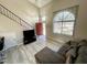 Inviting living room with high ceilings, a large window, and comfortable seating area at 500 N Roosevelt Ave # 53, Chandler, AZ 85226