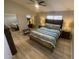 Serene bedroom with a comfortable bed, ceiling fan, and ample natural light from the windows at 500 N Roosevelt Ave # 53, Chandler, AZ 85226