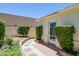 Backyard garden view with brick pavers, trimmed shrubbery, and rear house access at 5112 N 32Nd Pl, Phoenix, AZ 85018