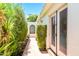 Backyard patio view showing brick pathway, greenery, and the exterior of the home at 5112 N 32Nd Pl, Phoenix, AZ 85018