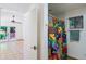 The bathroom features a colorful shower curtain and is adjacent to a bedroom and outside access at 5112 N 32Nd Pl, Phoenix, AZ 85018