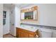 Bright bathroom features a double sink vanity with colorful tile accents and a wooden framed mirror at 5112 N 32Nd Pl, Phoenix, AZ 85018
