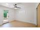 Bright bedroom with light hardwood floors and access to the outdoors at 5112 N 32Nd Pl, Phoenix, AZ 85018