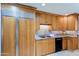 Kitchen features stainless steel appliances, wood cabinets, and ample counter space at 5112 N 32Nd Pl, Phoenix, AZ 85018