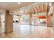 Open living space featuring Saltillo floors, exposed brick columns, and vaulted ceilings at 5112 N 32Nd Pl, Phoenix, AZ 85018