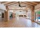 Open-concept living area with Saltillo tile floors, exposed brick beams, and vaulted ceilings at 5112 N 32Nd Pl, Phoenix, AZ 85018