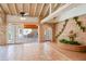 An open living area featuring brick accents, terracotta tile, and an indoor water feature at 5112 N 32Nd Pl, Phoenix, AZ 85018