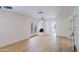 Spacious living room with light hardwood floors, a fireplace, and French doors providing an airy and inviting space at 5112 N 32Nd Pl, Phoenix, AZ 85018