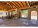 Spacious covered patio with brick columns, fireplace, and Saltillo tile flooring, perfect for entertaining at 5112 N 32Nd Pl, Phoenix, AZ 85018