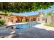 Sparkling pool with a covered patio and lush greenery, ideal for outdoor entertaining and relaxation at 5112 N 32Nd Pl, Phoenix, AZ 85018