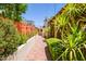 Side yard with lush landscaping and a brick pathway, enhancing the property's curb appeal at 5112 N 32Nd Pl, Phoenix, AZ 85018