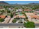 Expansive property with gorgeous landscaping, tile roof, and mountain views in distance at 5320 W Soft Wind Dr, Glendale, AZ 85310
