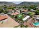 Beautiful aerial view of a home featuring a pool, playground, and sports court in backyard at 5320 W Soft Wind Dr, Glendale, AZ 85310
