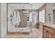 This bathroom features a large glass enclosed walk-in shower with beautiful tile work at 5320 W Soft Wind Dr, Glendale, AZ 85310