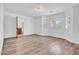 Spacious bedroom featuring wood floors, natural light, and a bathroom view at 5320 W Soft Wind Dr, Glendale, AZ 85310