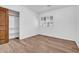 This bedroom features wood-look floors and plantation shutters at 5320 W Soft Wind Dr, Glendale, AZ 85310