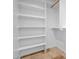 Bright walk-in closet showcasing built-in shelving and a clothing rod at 5320 W Soft Wind Dr, Glendale, AZ 85310