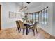 Elegant dining room features a modern light fixture, seating for six, and large windows for natural light at 5320 W Soft Wind Dr, Glendale, AZ 85310
