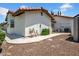 Practical backyard featuring the home, utilities and storage including A/C, propane and shed at 5320 W Soft Wind Dr, Glendale, AZ 85310
