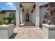 Elegant entrance featuring stately pillars, tiled walkway and decorative iron door at 5320 W Soft Wind Dr, Glendale, AZ 85310
