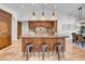 Spacious kitchen with a large island, custom wood cabinetry, granite countertops, and stainless steel appliances at 5320 W Soft Wind Dr, Glendale, AZ 85310