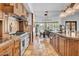 Well-equipped kitchen showcasing stainless steel appliances, a kitchen island, and an eat-in dining area at 5320 W Soft Wind Dr, Glendale, AZ 85310