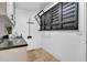 This laundry room features extra storage and a hanging rack for convenience at 5320 W Soft Wind Dr, Glendale, AZ 85310