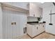 A well-organized laundry room includes storage and a folding area at 5320 W Soft Wind Dr, Glendale, AZ 85310