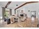 Inviting living room showcasing a fireplace, tile flooring, neutral decor, and ample seating at 5320 W Soft Wind Dr, Glendale, AZ 85310