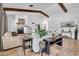 Comfortable living room with fireplace, tile flooring, stylish decor, and plenty of natural light at 5320 W Soft Wind Dr, Glendale, AZ 85310