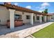 Covered patio with columns, tile flooring, hot tub, and outdoor lighting at 5320 W Soft Wind Dr, Glendale, AZ 85310