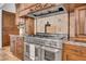 This professional-grade range features a stainless steel finish, a decorative hood, and ample counter space at 5320 W Soft Wind Dr, Glendale, AZ 85310