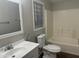 Bathroom featuring a toilet, a sink, and a combined shower and bathtub at 5933 E Main St # 1, Mesa, AZ 85206