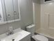 Bathroom featuring a toilet, a sink, and a combined shower and bathtub at 5933 E Main St # 1, Mesa, AZ 85206