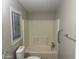 Bathroom featuring a toilet, a sink, and a combined shower and bathtub at 5933 E Main St # 1, Mesa, AZ 85206