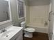 Bathroom featuring a toilet, a sink, and a combined shower and bathtub with dark wood floors at 5933 E Main St # 1, Mesa, AZ 85206