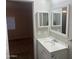 A bathroom featuring a sink and a medicine cabinet with a view to the bedroom at 5933 E Main St # 1, Mesa, AZ 85206