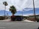 Charming home with mature landscaping, including lush bougainvillea, and a covered carport at 5933 E Main St # 1, Mesa, AZ 85206