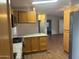 Charming kitchen featuring wooden cabinets, granite countertops, and modern stainless steel appliances at 5933 E Main St # 1, Mesa, AZ 85206