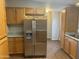 Well-equipped kitchen with stainless steel refrigerator and modern appliances at 5933 E Main St # 1, Mesa, AZ 85206