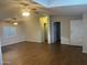 Spacious living room features wood floors, skylights, and ceiling fans at 5933 E Main St # 1, Mesa, AZ 85206