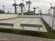 Outdoor shuffleboard area with benches and palm trees at 5933 E Main St # 1, Mesa, AZ 85206