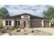 Charming single-story home featuring stone accents, desert landscaping, and a three-car garage at 6848 N 190Th Ave, Waddell, AZ 85355