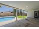 Inviting back patio overlooking a refreshing pool and lush lawn, perfect for outdoor relaxation at 727 N Beverly --, Mesa, AZ 85201