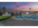 Inviting backyard featuring a pristine private pool, perfect for relaxation and entertaining under a colorful sky at 727 N Beverly --, Mesa, AZ 85201